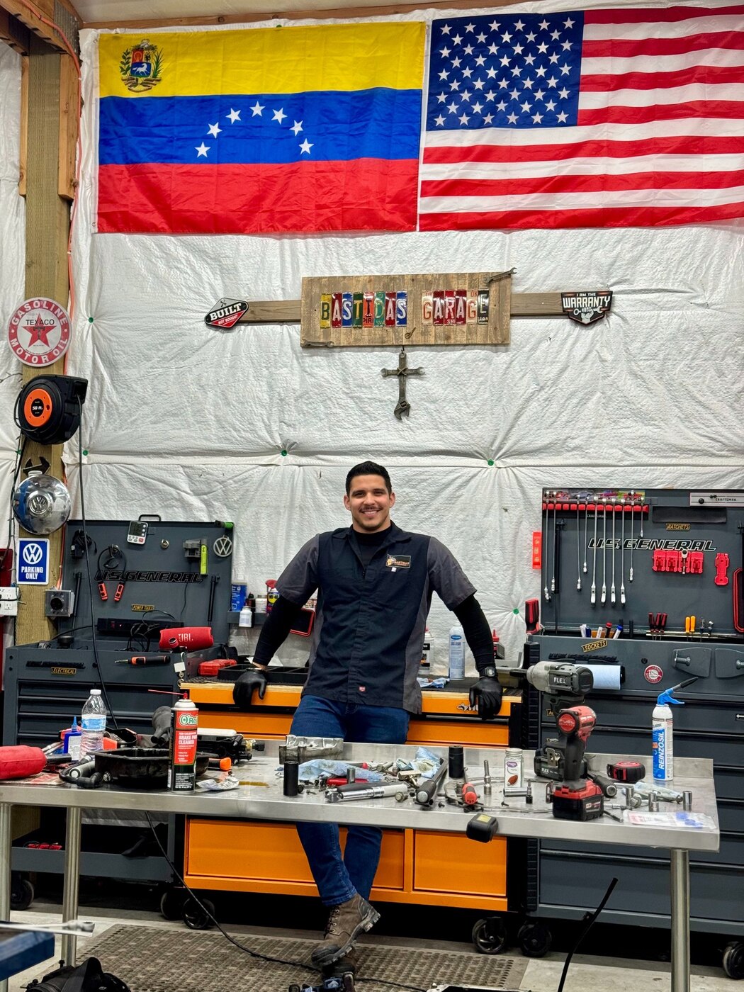 Gualberto Bastidas inside Bastidas Garage